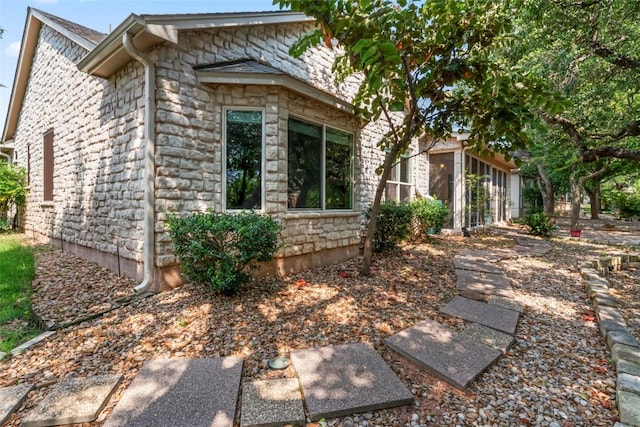 105 Saddle Trl, Georgetown, TX 78633 - view of side of home featuring stone siding