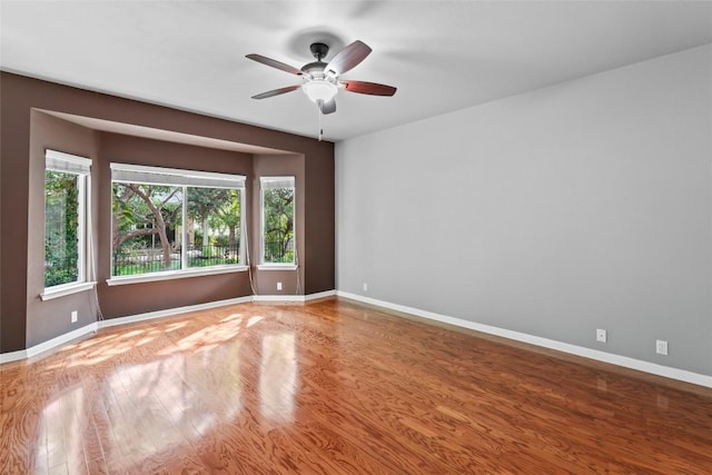 105 Saddle Trl, Georgetown, TX 78633 - empty room with baseboards, a ceiling fan, and wood finished floors