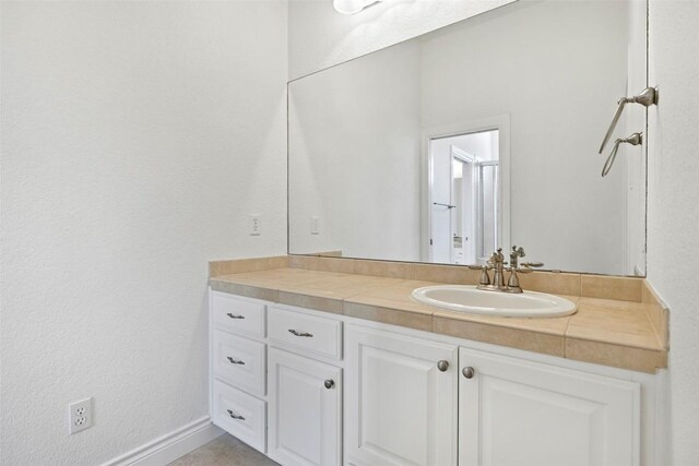 110 Woodall Dr, Georgetown, TX 78628 - bathroom featuring vanity and baseboards