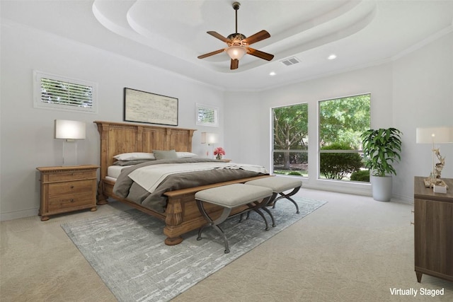 110 Woodall Dr, Georgetown, TX 78628 - bedroom featuring light colored carpet, a raised ceiling, a ceiling fan, and recessed lighting