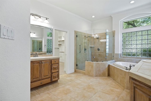 110 Woodall Dr, Georgetown, TX 78628 - bathroom with a stall shower, ornamental molding, a garden tub, vanity, and tile patterned floors