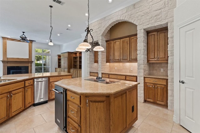 110 Woodall Dr, Georgetown, TX 78628 - kitchen with a ceiling fan, light tile patterned flooring, a center island, brown cabinets, and recessed lighting
