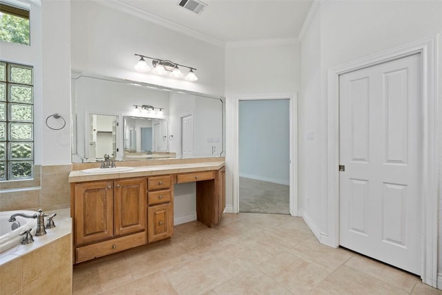 110 Woodall Dr, Georgetown, TX 78628 - full bathroom featuring vanity, ornamental molding, a garden tub, and tile patterned flooring