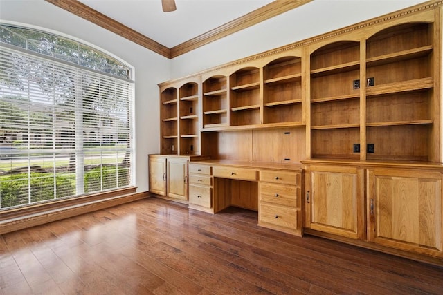 110 Woodall Dr, Georgetown, TX 78628 - unfurnished office with built in desk, crown molding, and dark wood-style flooring