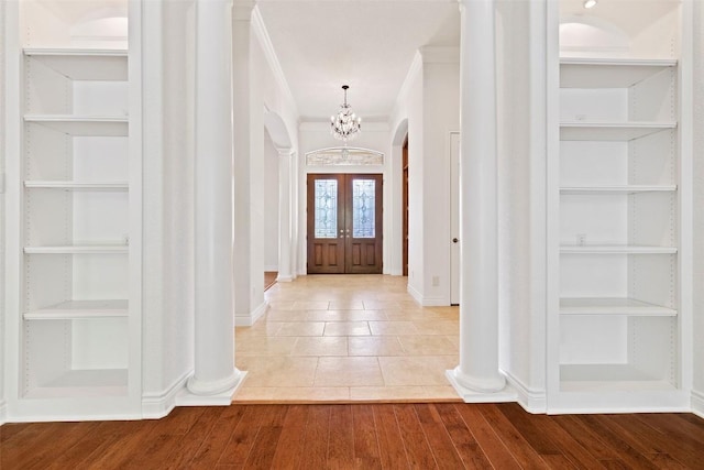 110 Woodall Dr, Georgetown, TX 78628 - entryway featuring baseboards, ornamental molding, a chandelier, and arched walkways