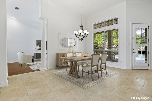 110 Woodall Dr, Georgetown, TX 78628 - dining room featuring crown molding, ornate columns, baseboards, light tile patterned flooring, and a chandelier