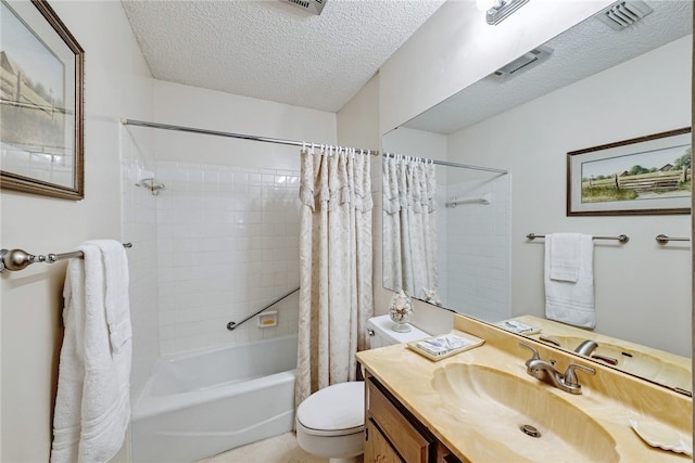 full bathroom featuring toilet, vanity, shower / bath combo with shower curtain, and a textured ceiling