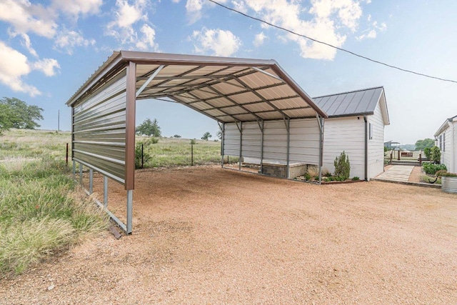 770 Stanton Rd, Johnson City, TX 78636 - view of outdoor structure with driveway and a detached carport