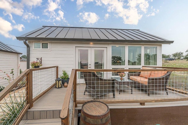 770 Stanton Rd, Johnson City, TX 78636 - rear view of house with a standing seam roof, metal roof, and french doors