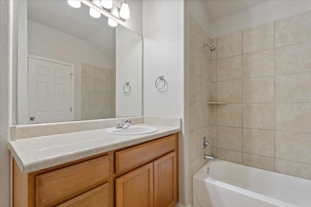 bathroom with tub / shower combination and vanity
