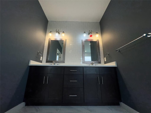 bathroom with decorative backsplash, double vanity, and a sink