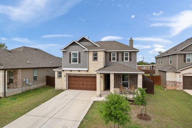130 Mcginnis Trl, Kyle, TX 78640 - view of front of home with stone siding, a garage, fence, a front yard, and driveway