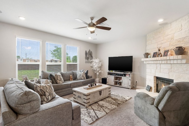 130 Mcginnis Trl, Kyle, TX 78640 - living area with a fireplace, ceiling fan, light carpet, and recessed lighting