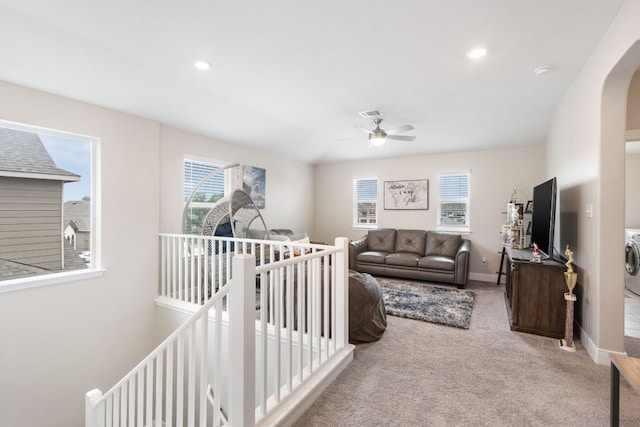 130 Mcginnis Trl, Kyle, TX 78640 - carpeted living room with arched walkways, a ceiling fan, baseboards, and recessed lighting