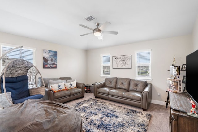 130 Mcginnis Trl, Kyle, TX 78640 - living room featuring light colored carpet, baseboards, ceiling fan, and visible vents