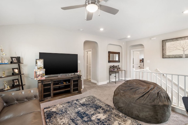 130 Mcginnis Trl, Kyle, TX 78640 - carpeted living area featuring arched walkways, recessed lighting, and a ceiling fan
