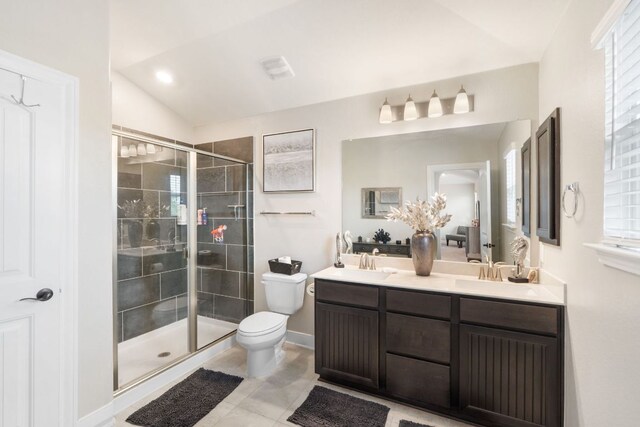 130 Mcginnis Trl, Kyle, TX 78640 - bathroom with double vanity, toilet, a shower stall, and a sink
