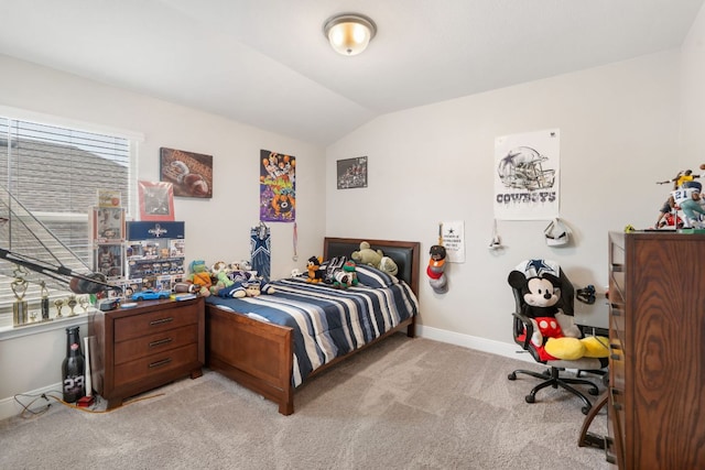 130 Mcginnis Trl, Kyle, TX 78640 - bedroom featuring lofted ceiling, light carpet, and baseboards