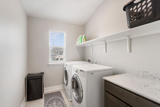 130 Mcginnis Trl, Kyle, TX 78640 - laundry area with baseboards, separate washer and dryer, laundry area, and light tile patterned floors