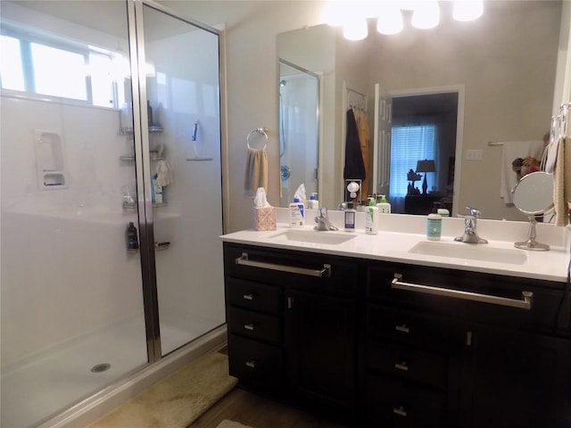124 Rearden Blvd, Jarrell, TX 76537 - bathroom with a shower stall and double vanity
