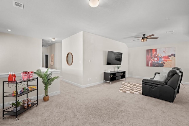 living room with ceiling fan, carpet floors, baseboards, and visible vents