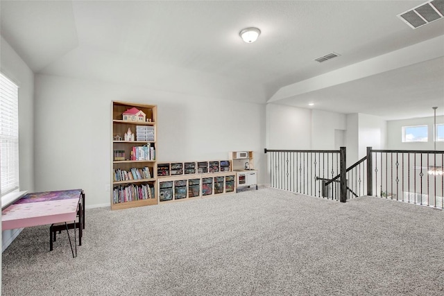 sitting room featuring carpet floors and visible vents