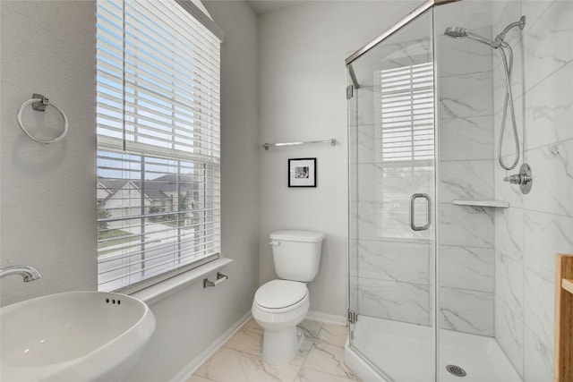 full bath featuring a sink, toilet, a marble finish shower, and marble finish floor