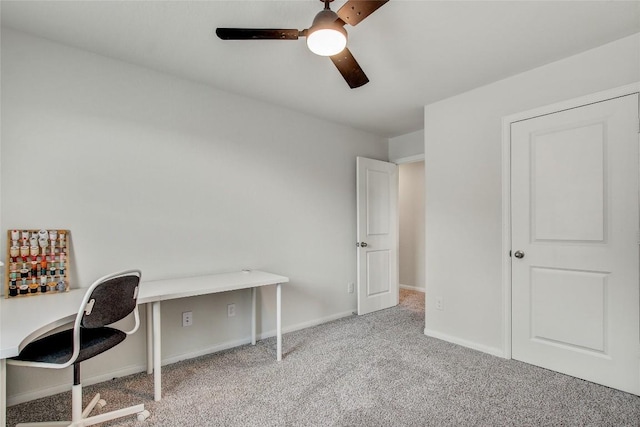 home office with carpet flooring, baseboards, and a ceiling fan