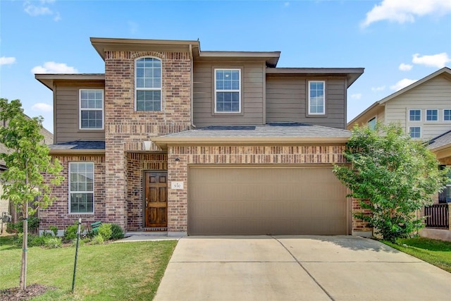 view of front of home featuring concrete driveway, an attached garage, brick siding, and a front yard