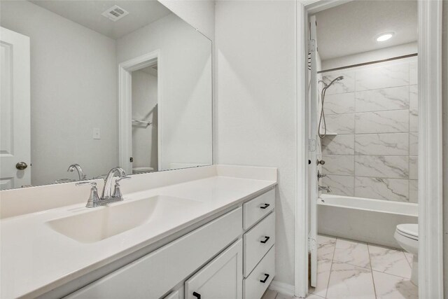 930 Blue Oak Blvd, San Marcos, TX 78666 - bathroom with marble finish flooring, vanity, toilet, and  shower combination