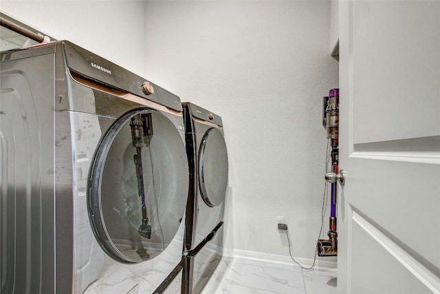 930 Blue Oak Blvd, San Marcos, TX 78666 - washroom featuring independent washer and dryer, marble finish floors, and baseboards