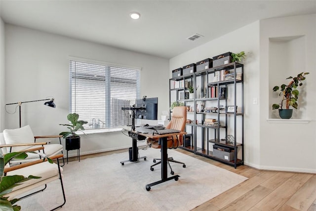 home office with light wood-type flooring, recessed lighting, baseboards, and visible vents