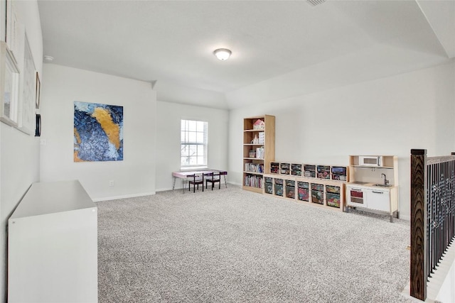 game room featuring carpet flooring and baseboards