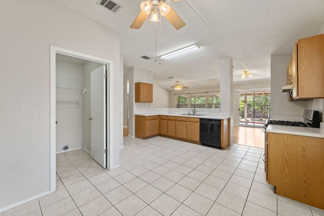 kitchen with black dishwasher, ceiling fan, a sink, and light countertops