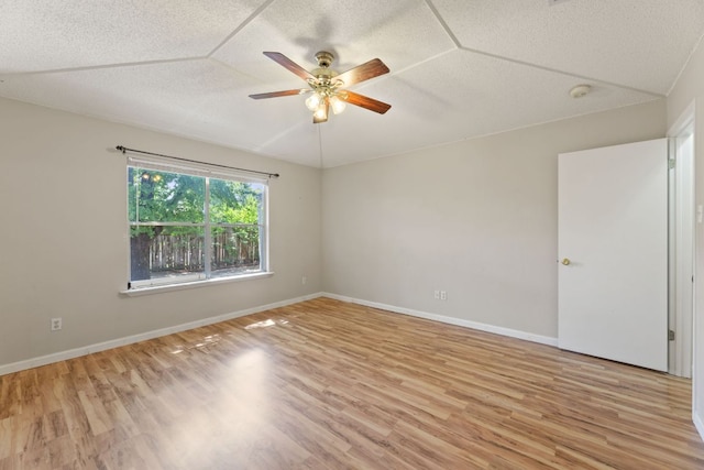 1216 Acanthus St, Pflugerville, TX 78660 - empty room featuring light wood-style floors, a textured ceiling, a ceiling fan, a smoke detector, and baseboards