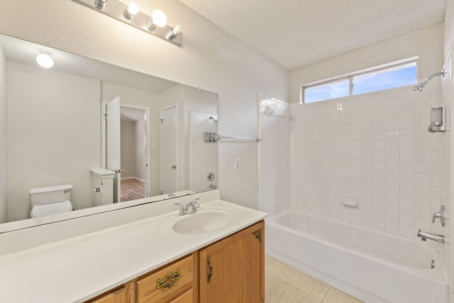 full bath featuring toilet, tile patterned floors, bathing tub / shower combination, and vanity