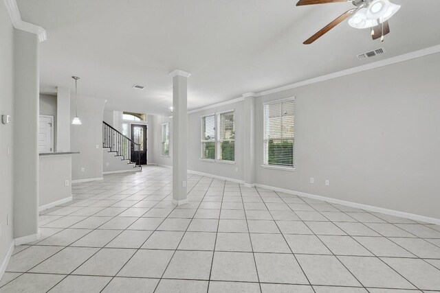400 Hummingbird Ln Unit A, Austin, TX 78734 - spare room featuring crown molding, a ceiling fan, light tile patterned flooring, stairs, and ornate columns