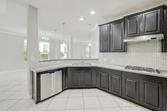 400 Hummingbird Ln Unit A, Austin, TX 78734 - kitchen with stainless steel appliances, under cabinet range hood, crown molding, light countertops, and decorative backsplash