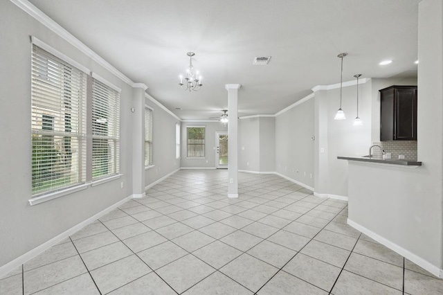 400 Hummingbird Ln Unit A, Austin, TX 78734 - unfurnished living room with a ceiling fan, crown molding, light tile patterned floors, and a chandelier