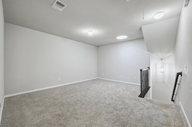400 Hummingbird Ln Unit A, Austin, TX 78734 - empty room featuring carpet floors and a textured ceiling
