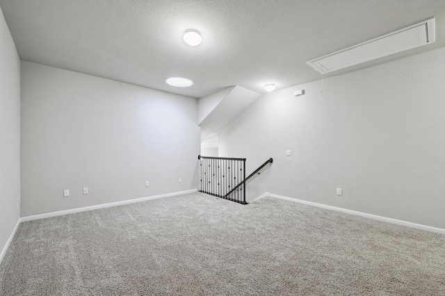 400 Hummingbird Ln Unit A, Austin, TX 78734 - spare room featuring attic access, carpet flooring, and a textured ceiling