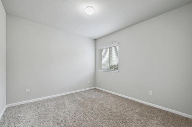 400 Hummingbird Ln Unit A, Austin, TX 78734 - carpeted spare room featuring baseboards