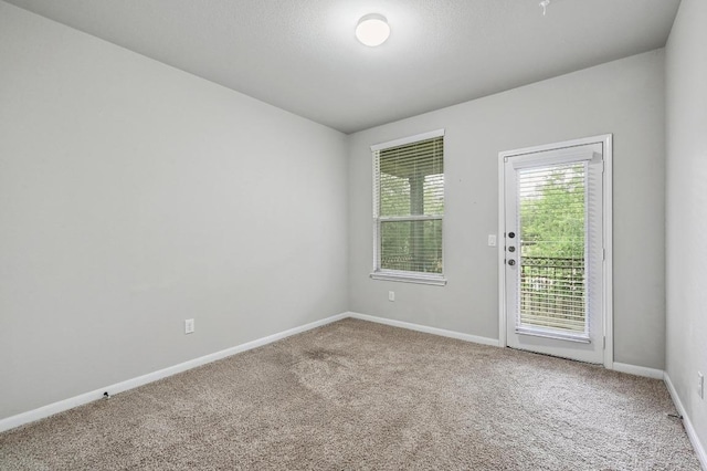 400 Hummingbird Ln Unit A, Austin, TX 78734 - carpeted empty room featuring baseboards