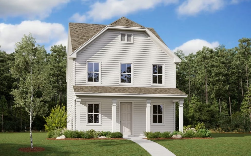 view of front of house featuring roof with shingles and a front yard