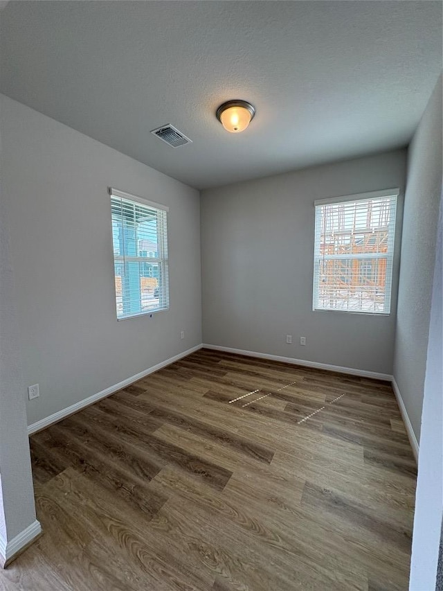 108 Elm Branch Trl, Taylor, TX 76574 - empty room with wood finished floors and baseboards