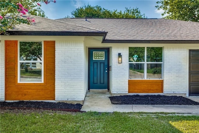 6220 Blarwood Dr, Austin, TX 78745 - property entrance with a shingled roof and brick siding