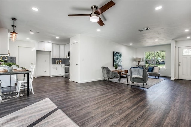 6220 Blarwood Dr, Austin, TX 78745 - living area featuring ceiling fan, dark wood-style flooring, recessed lighting, and baseboards