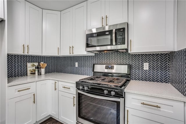 6220 Blarwood Dr, Austin, TX 78745 - kitchen featuring stainless steel appliances, backsplash, and white cabinets