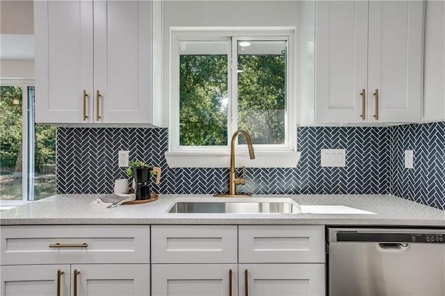 6220 Blarwood Dr, Austin, TX 78745 - kitchen featuring dishwasher, a sink, white cabinets, and tasteful backsplash