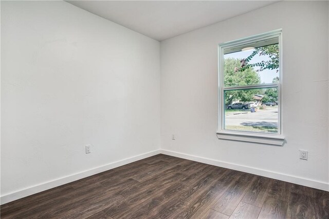 6220 Blarwood Dr, Austin, TX 78745 - empty room featuring dark wood-type flooring and baseboards